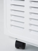 Close-up of a white dehumidifier with a black wheel on a light gray background